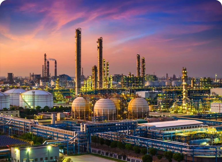Oil refinery with vibrant sunset sky